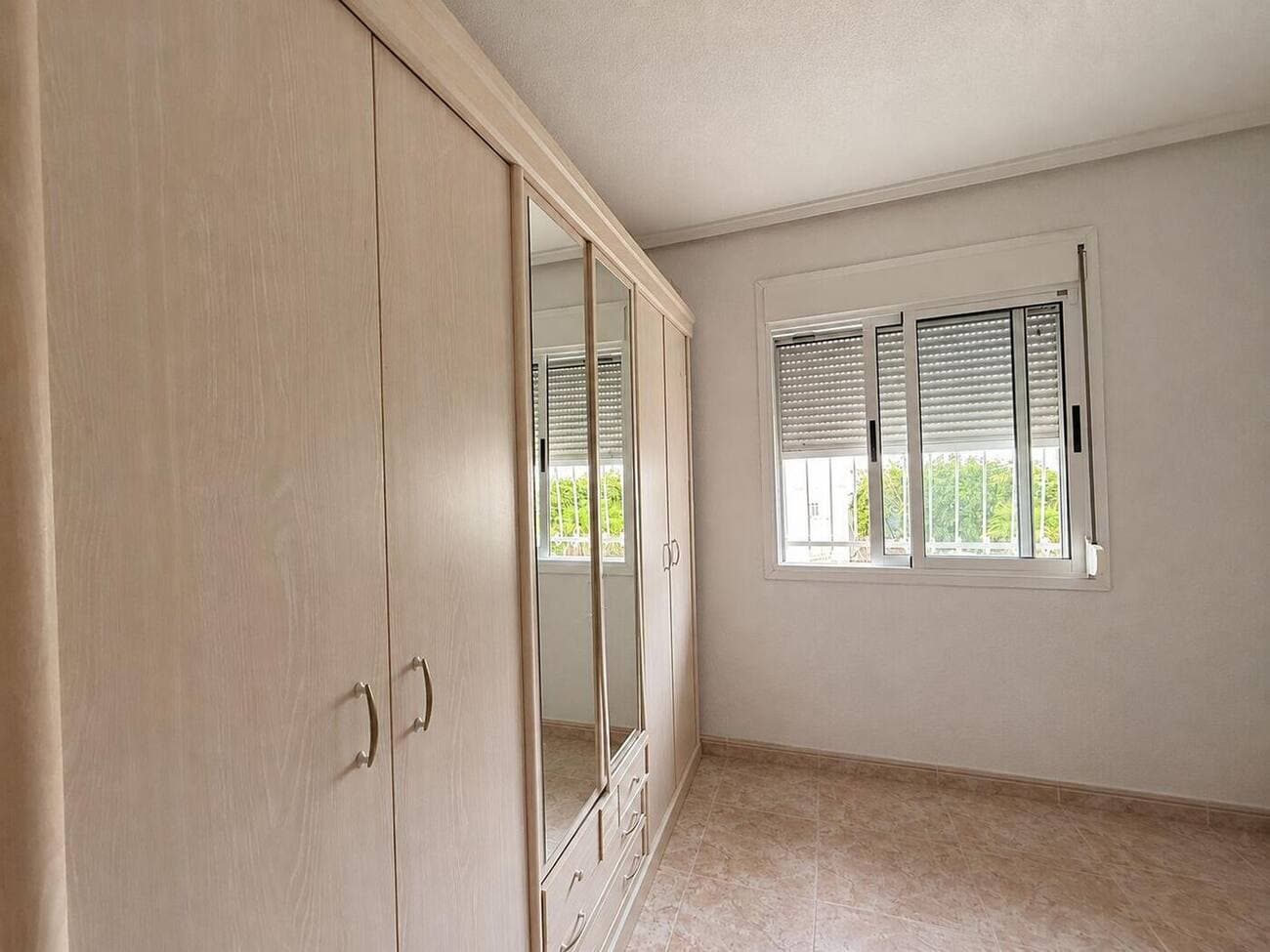 Main bedroom with sliding fitted wardrobes