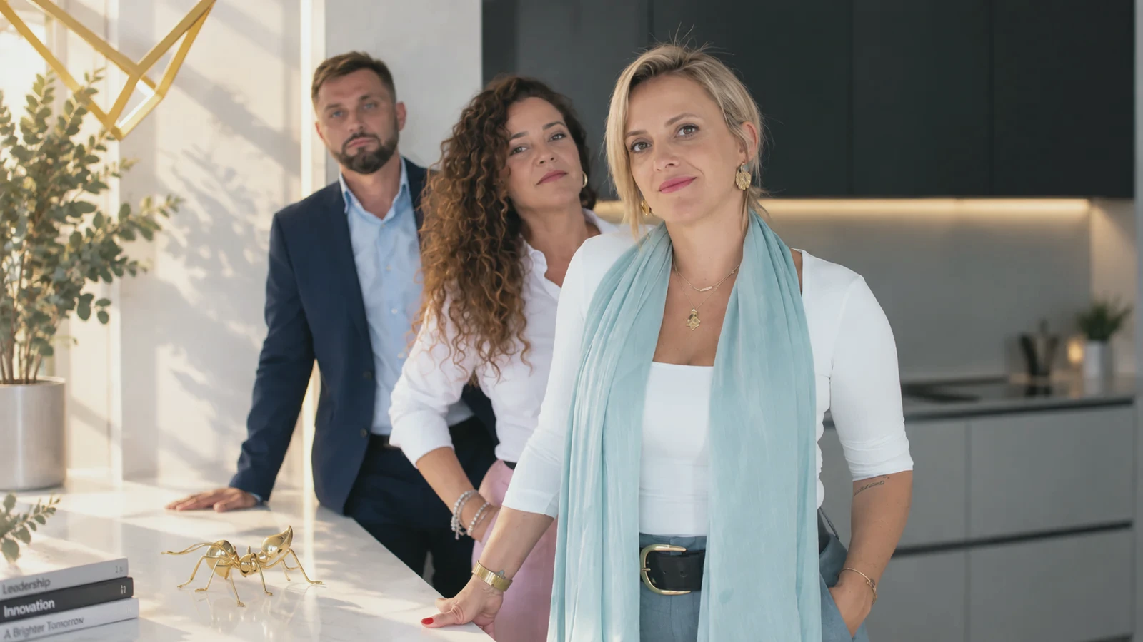 Sarah Katerina with two members of her team
